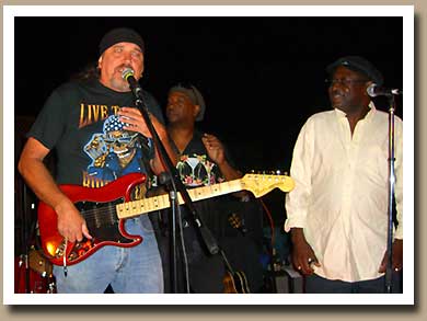 Tom Baggett singing with Donnie "the Velvet Dinosaur" Baker and The Deacon
